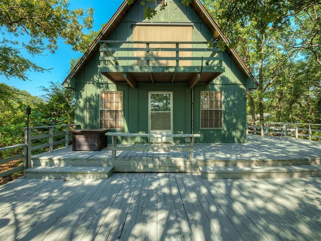 back of house featuring a deck