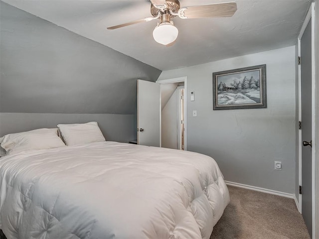 carpeted bedroom with ceiling fan and lofted ceiling