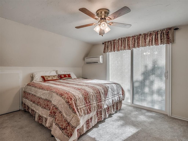 carpeted bedroom featuring ceiling fan, a wall mounted air conditioner, and lofted ceiling