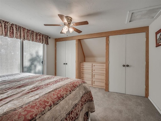 bedroom with ceiling fan, light colored carpet, and lofted ceiling