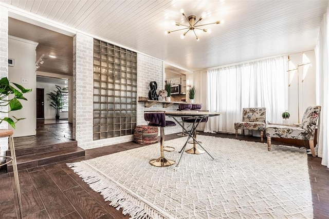 home office featuring an inviting chandelier and hardwood / wood-style flooring