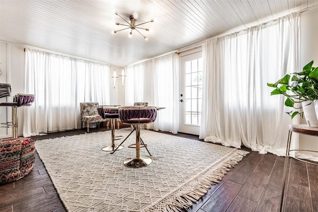 sunroom with a chandelier