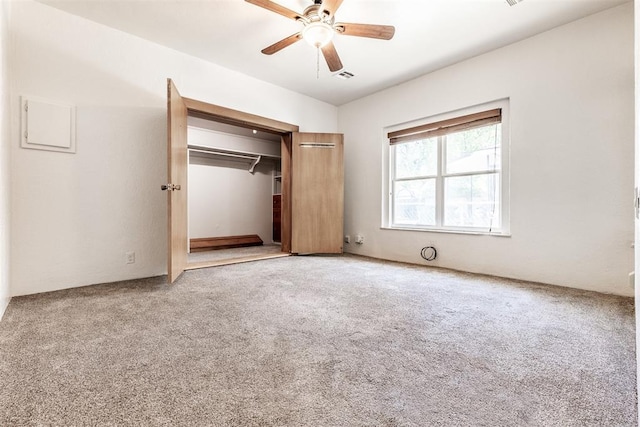 unfurnished bedroom with a closet, ceiling fan, and carpet