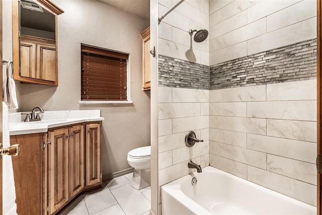 full bathroom with tiled shower / bath, vanity, tile patterned floors, and toilet