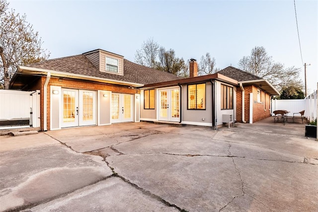 back of house with a patio area and french doors