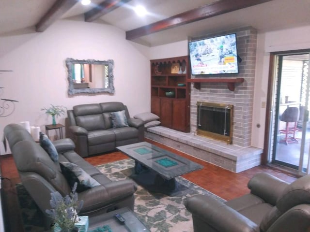 living room featuring beam ceiling and a brick fireplace