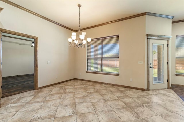 unfurnished dining area with plenty of natural light, crown molding, and ceiling fan with notable chandelier