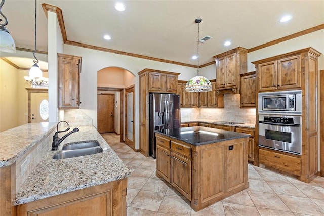 kitchen with sink, hanging light fixtures, stainless steel appliances, kitchen peninsula, and dark stone countertops