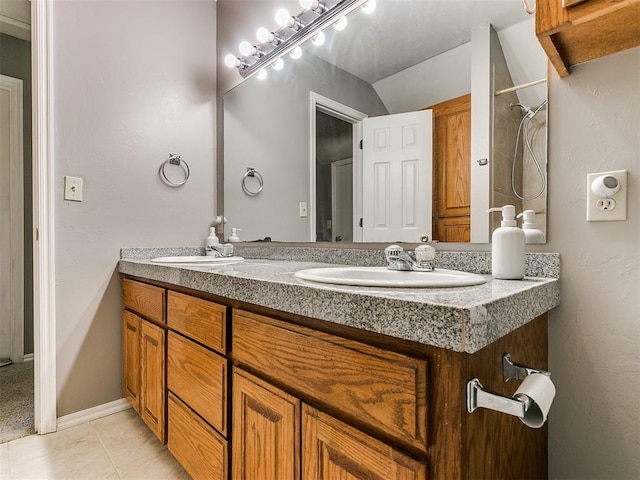 bathroom with tile patterned floors and vanity