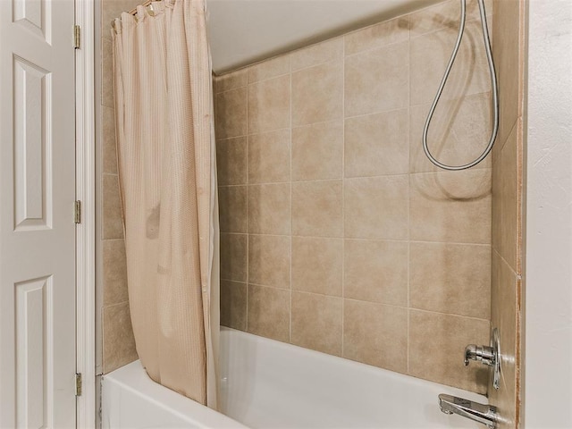 bathroom featuring shower / bath combo with shower curtain