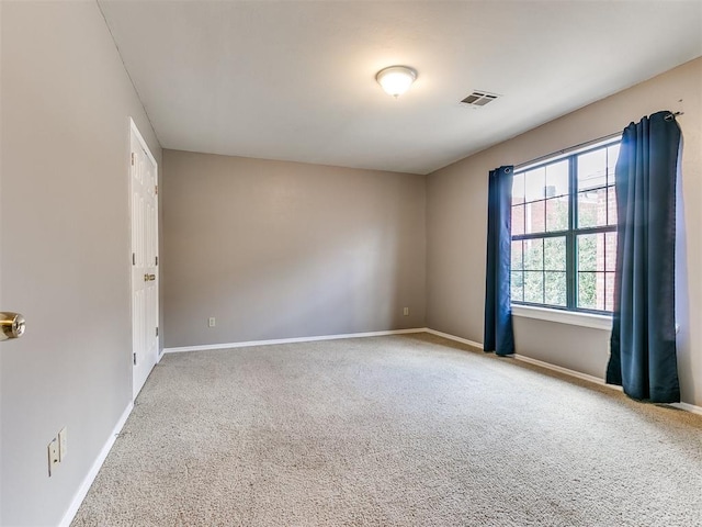 unfurnished room featuring carpet flooring