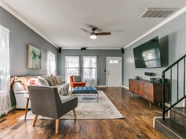 living room featuring ceiling fan, dark hardwood / wood-style flooring, and ornamental molding