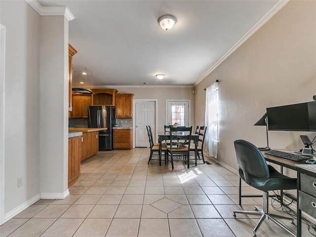 interior space with light tile patterned floors and ornamental molding