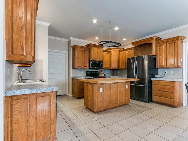 kitchen featuring sink, a center island, tasteful backsplash, black appliances, and ornamental molding