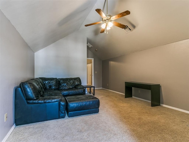 carpeted living room with ceiling fan and vaulted ceiling