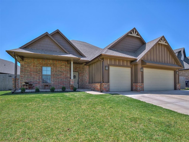 craftsman inspired home featuring a garage and a front lawn