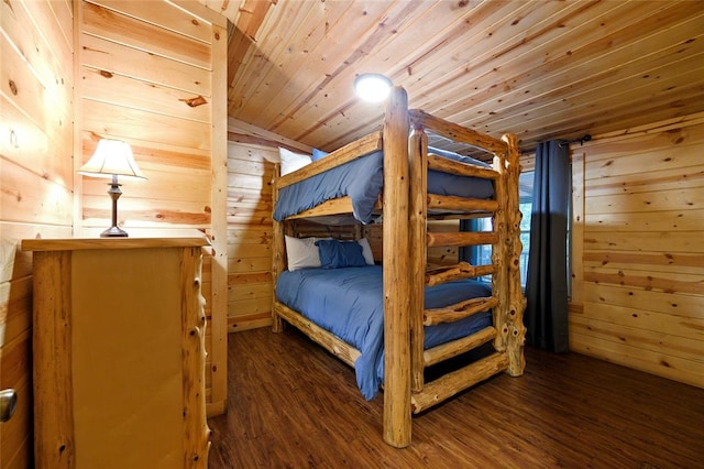 bedroom featuring dark hardwood / wood-style floors, wood walls, wood ceiling, and vaulted ceiling