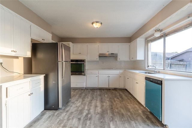 kitchen featuring light hardwood / wood-style floors, sink, white cabinetry, and stainless steel appliances