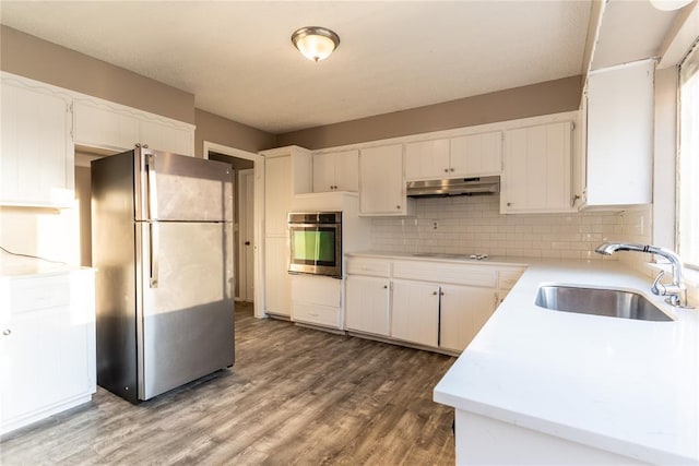 kitchen with white cabinets, sink, and stainless steel appliances