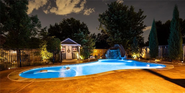 view of swimming pool featuring an outdoor structure