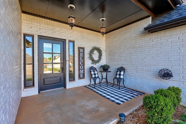 doorway to property featuring covered porch