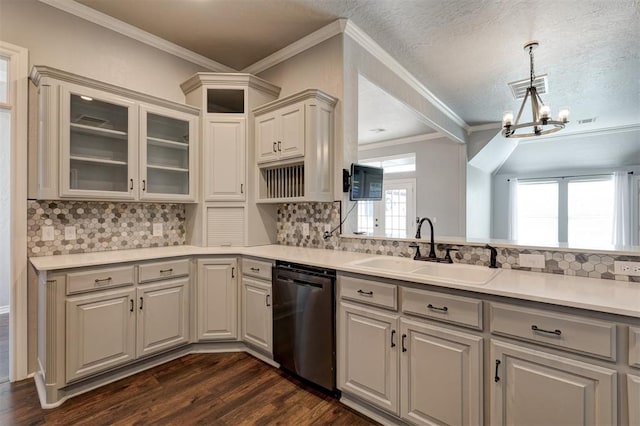 kitchen featuring an inviting chandelier, sink, stainless steel dishwasher, decorative backsplash, and dark hardwood / wood-style flooring