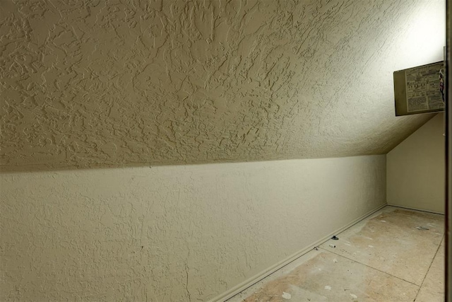 bonus room with vaulted ceiling