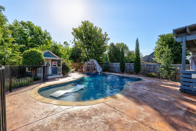 view of swimming pool featuring a patio area and a water slide