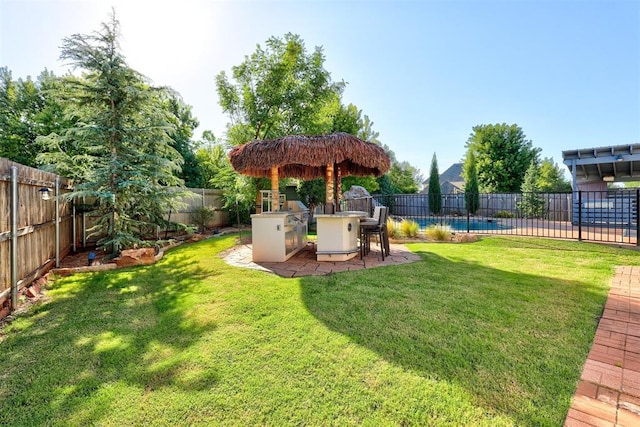 view of yard featuring exterior kitchen