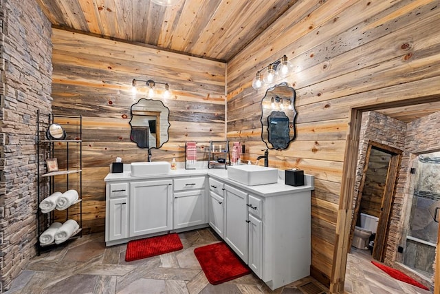 interior space featuring parquet floors, wood ceiling, vanity, toilet, and wood walls