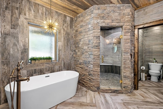 bathroom featuring wooden walls, wooden ceiling, lofted ceiling, and toilet