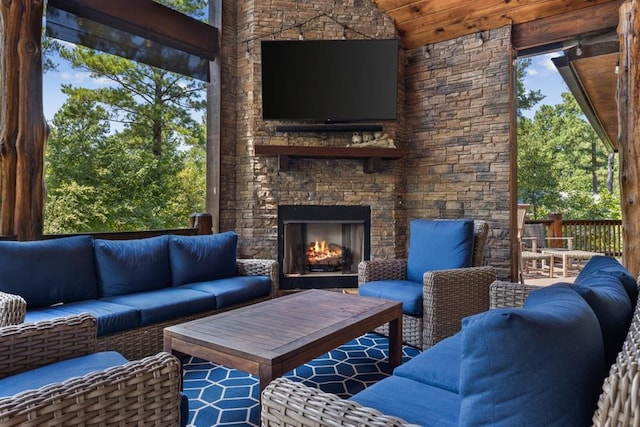 view of patio / terrace featuring an outdoor living space with a fireplace