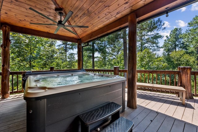 deck with ceiling fan and a hot tub