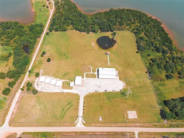 birds eye view of property with a water view and a rural view