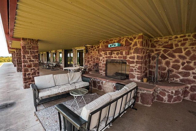 view of patio / terrace featuring an outdoor living space with a fireplace