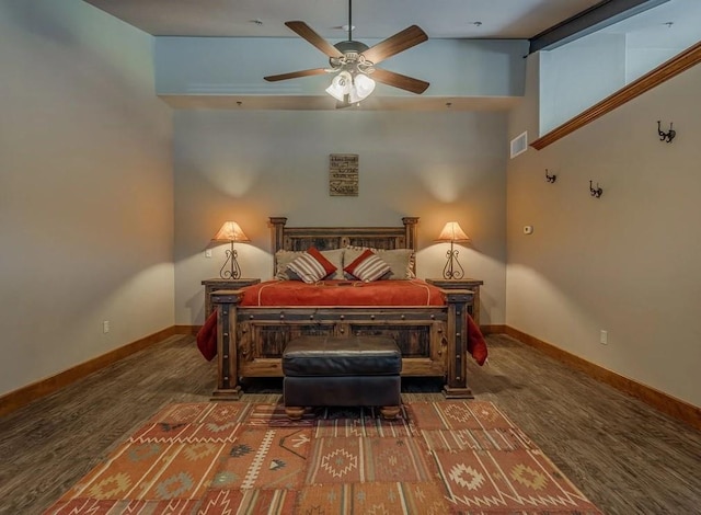 bedroom featuring a high ceiling, dark hardwood / wood-style floors, and ceiling fan