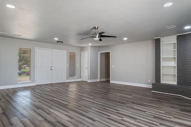 unfurnished living room featuring wood-type flooring and ceiling fan