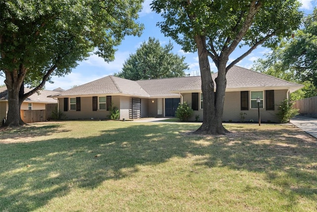 ranch-style house featuring a front lawn