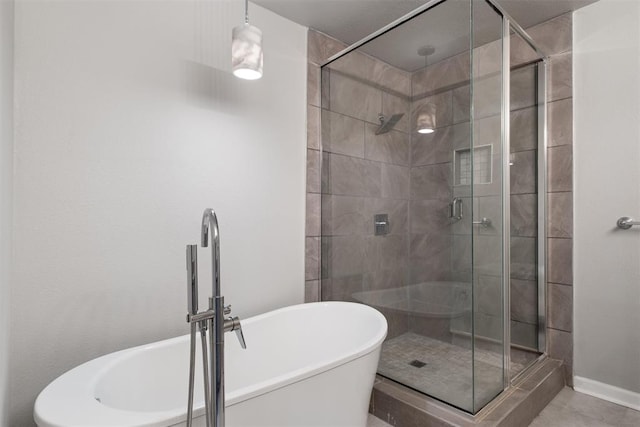 bathroom with shower with separate bathtub