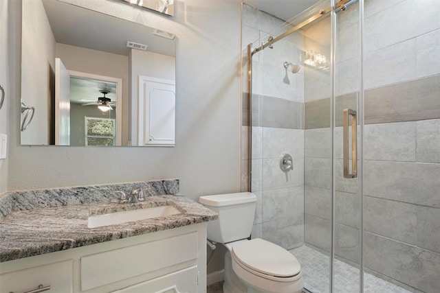 bathroom with ceiling fan, vanity, and an enclosed shower