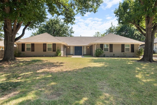 ranch-style house with a front lawn