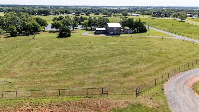 birds eye view of property with a rural view