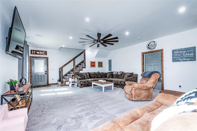 carpeted living room with ceiling fan