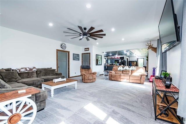 living room featuring ceiling fan and light carpet