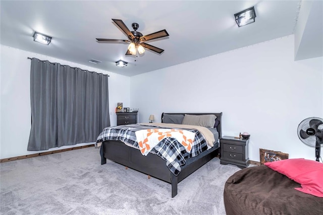 bedroom featuring light colored carpet and ceiling fan