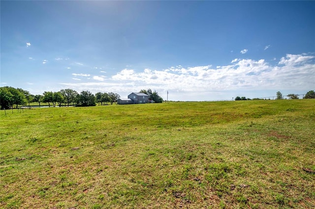 view of yard with a rural view