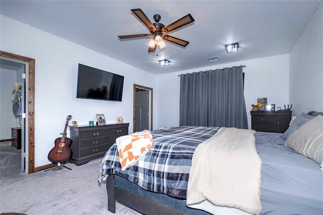 bedroom with ceiling fan and light colored carpet