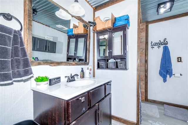 bathroom featuring hardwood / wood-style floors and vanity