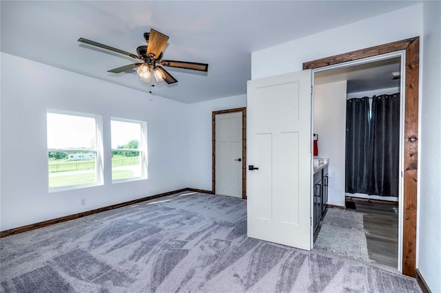 unfurnished bedroom featuring wood-type flooring, a closet, and ceiling fan