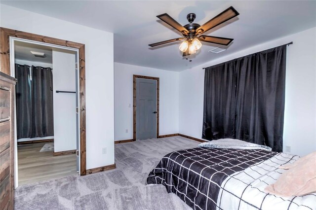 bedroom with light hardwood / wood-style flooring and ceiling fan